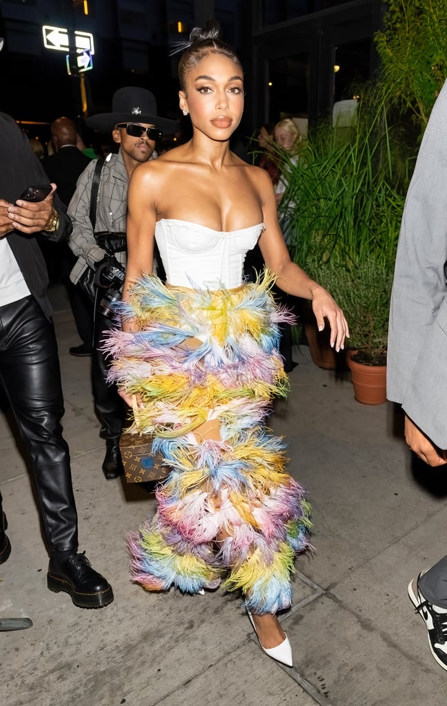 Lori Harvey's Corset Top and Feather Pants at Vogue World