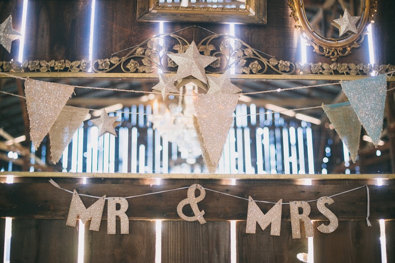 Display sparkly banners in your wedding colors.