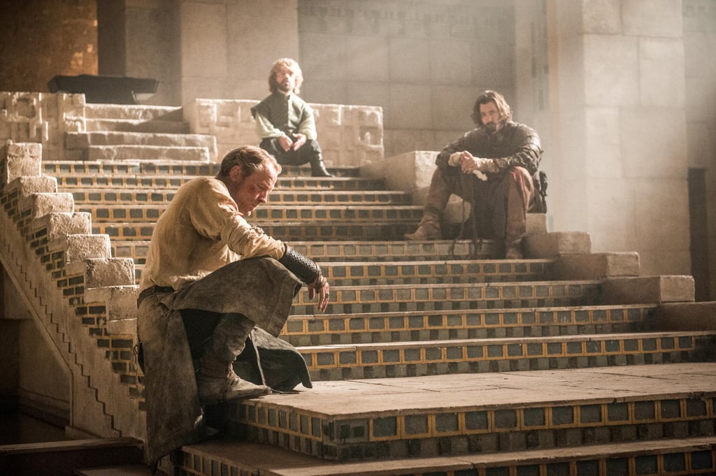 Jorah (Iain Glen), Tyrion (Peter Dinklage), and Daario (Michiel Huisman) sit around, probably wondering when Daenerys is coming home.