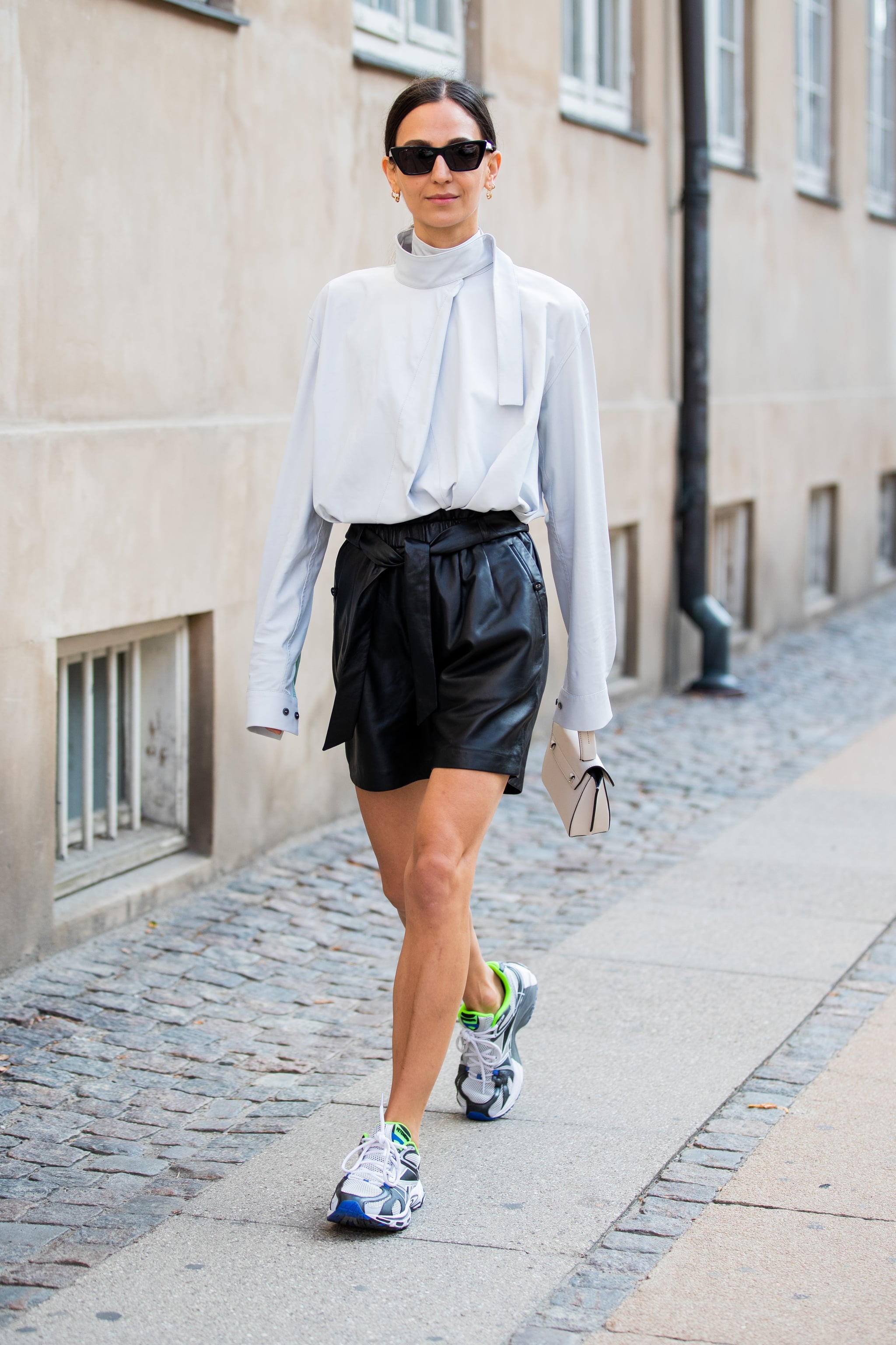 Try it all by styling a ladylike silk blouse with edgy leather shorts, How  to Wear Shorts For Fall, Because Yes You Can