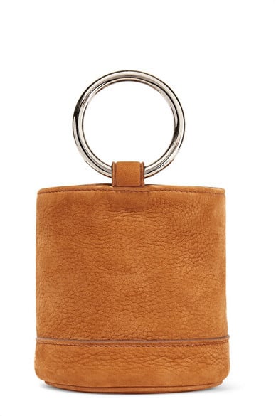 "I'm downsizing my bag game for Spring with Simon Miller's Bonsai bucket bag ($390). Functional and statement-making all at once — could you want anything more in a handbag?" — HWM