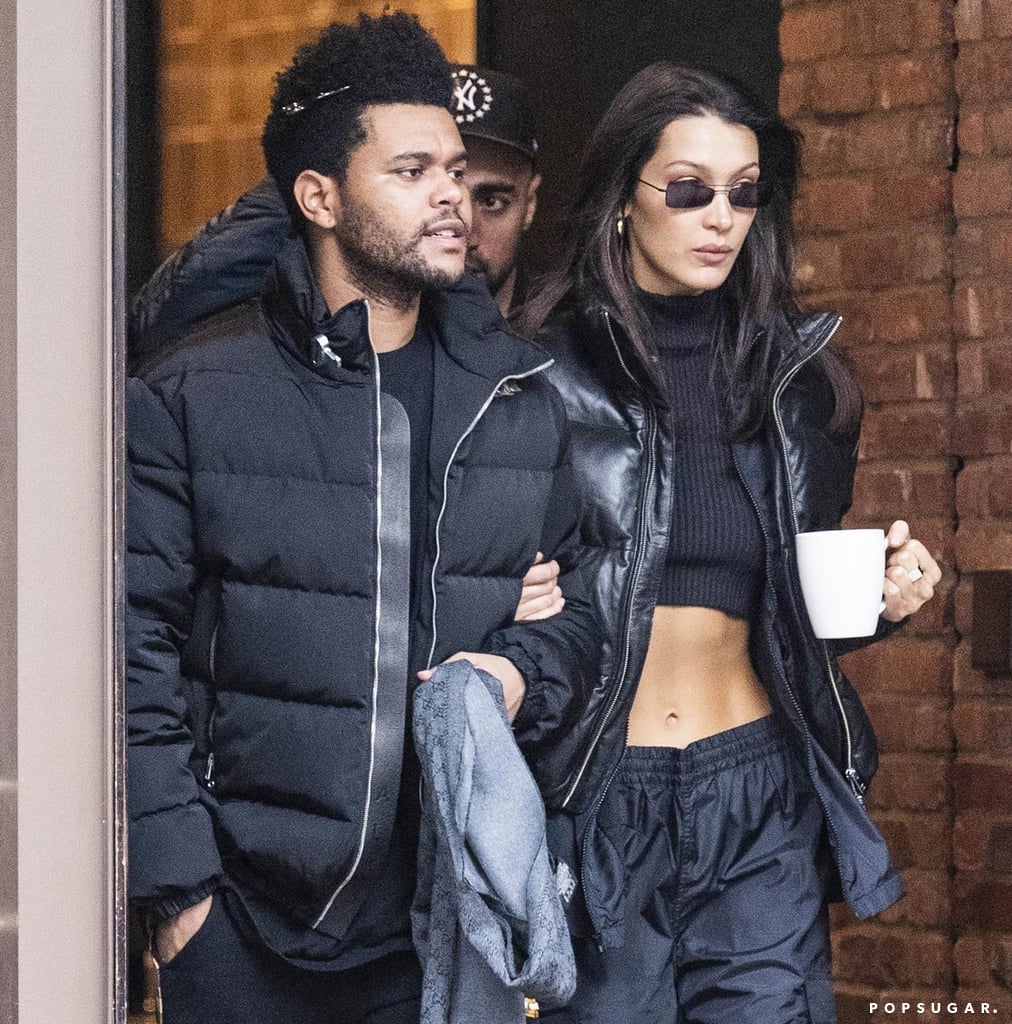 Bella Hadid Wearing a Crop Top and Puffer With The Weeknd