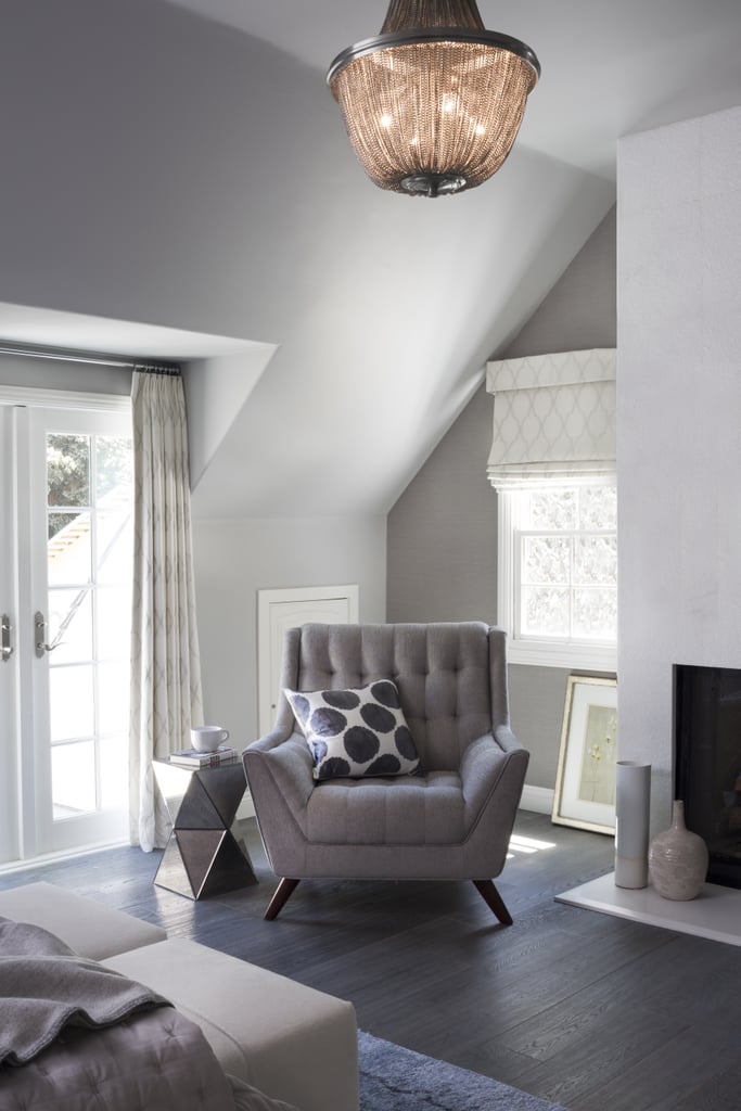 The master bedroom is centered around a stunning, full-height fireplace covered in Ann Sacks tile.
