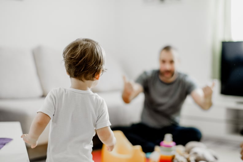 Father training his son to use potty at home