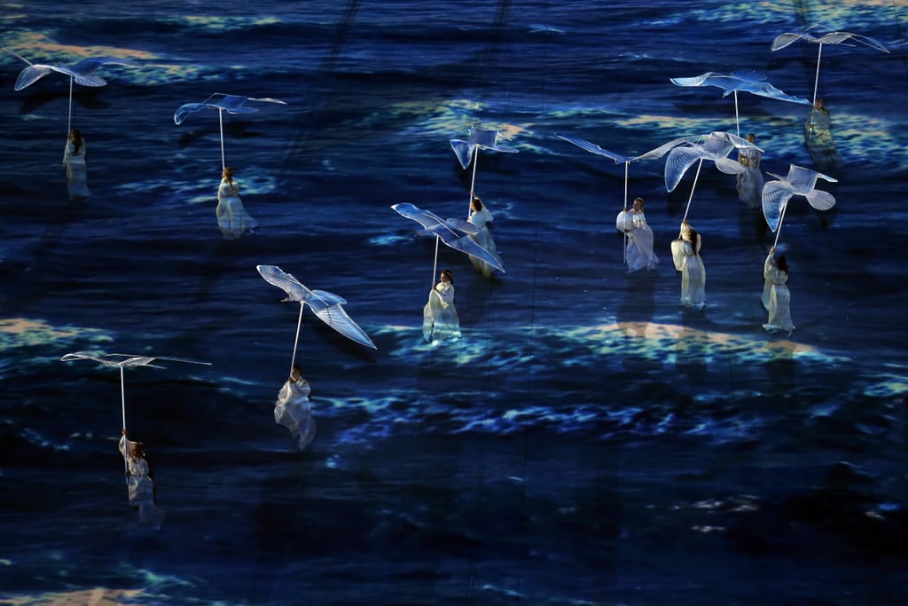 Dancers carried white, dovelike birds during their performance.