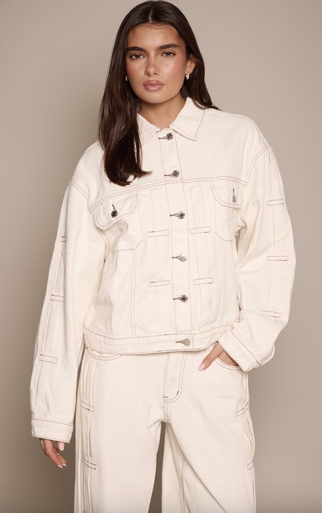 PrettyLittleThing Ecru Pleat Detail Boxy Denim Jacket ($30, originally $100)
 Vegas is warm, but nights can be cold and most buildings are air-conditioned. To stay comfortable, I suggest layering, and this white boxy denim jacket is the perfect addition. Pair it with white jeans and you'll have the perfect outfit.