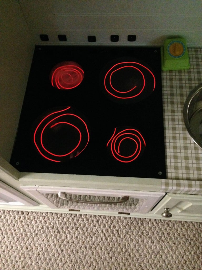 They connected the wires to a battery controller and set up a back panel to control the burners.
