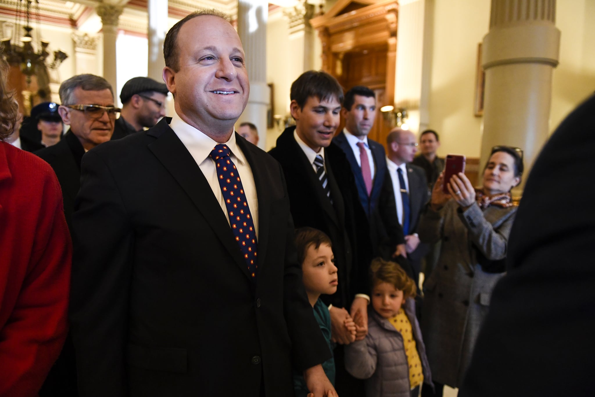 DENVER, CO - JANUARY 8: Governor-elect Jared Polis stands with his partner, Marlon Reis, and their children, Cora and Caspian, in the west wing before his inauguration at the Colorado State Capitol on Tuesday, January 8, 2019. (Photo by AAron Ontiveroz/The Denver Post via Getty Images)