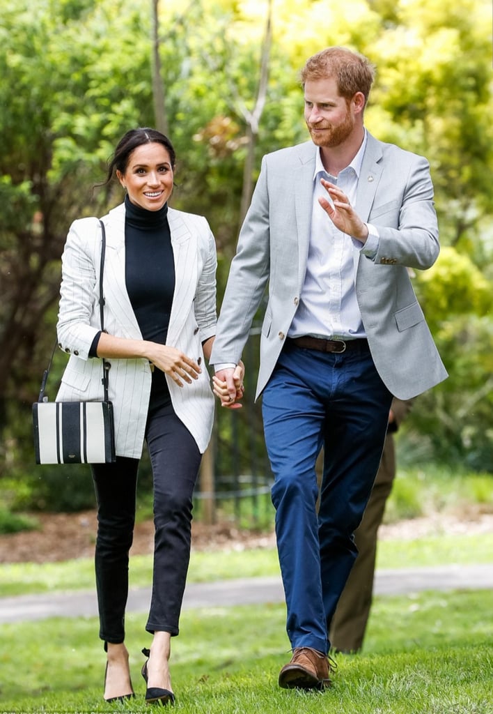 During another Australia stop, Meghan wore her Outland jeans with a sophisticated L'Agence blazer, Aquazzura bow slingbacks, Adina Reyter earrings, and a striped Oroton bag.