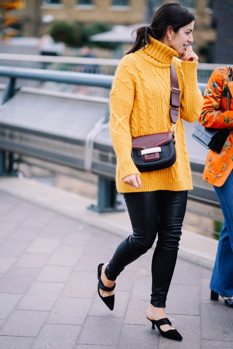 With a long cable-knit turtleneck for coverage and comfort.