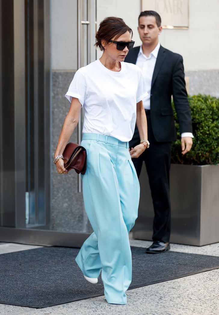 Victoria Beckham Wears White T-Shirt and Blue Pants