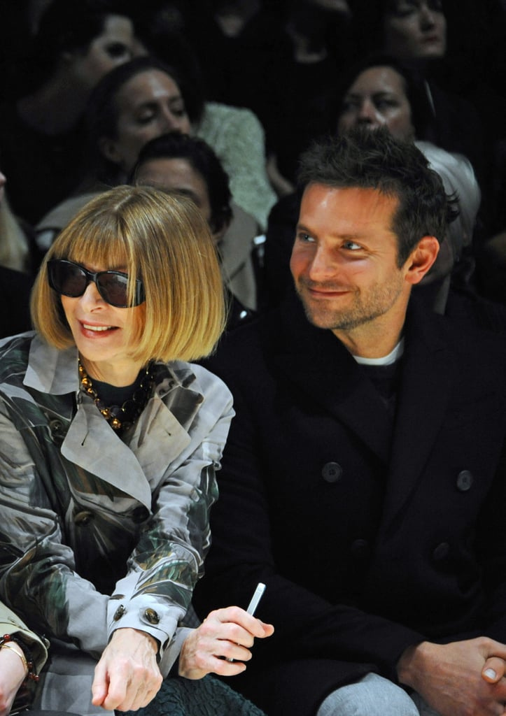Bradley Cooper supported his girlfriend, Suki Waterhouse, as she modeled at London Fashion Week, sitting from row with Vogue editor Anna Wintour.