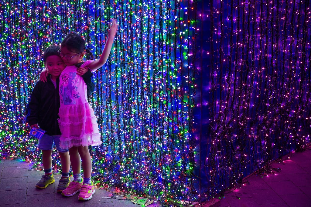 Kids posed in front of the light display in Canberra, Australia, which featured more than one million lights.