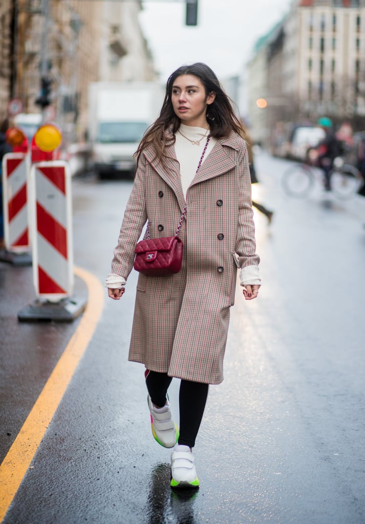 With a Checked Coat, a Cream Jumper, and Black Leggings