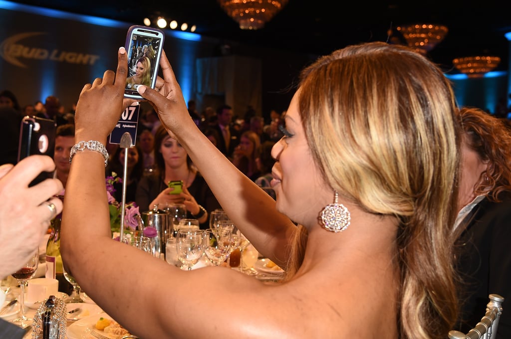 Orange Is the New Black actress Laverne Cox snaps a selfie at the 25th Annual GLAAD Media Awards in April 2014.