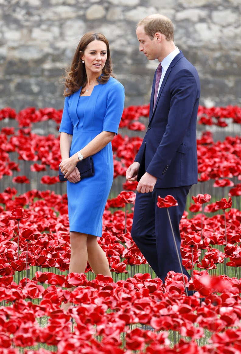 Kate’s Dark Blue Clutch Matched William’s Suit Amidst the Bright Poppies