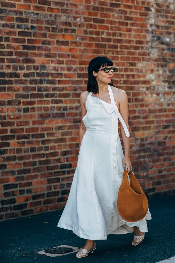 A simple mesh kitten-heel mule and oversize hobo bag elevate a basic white maxi.