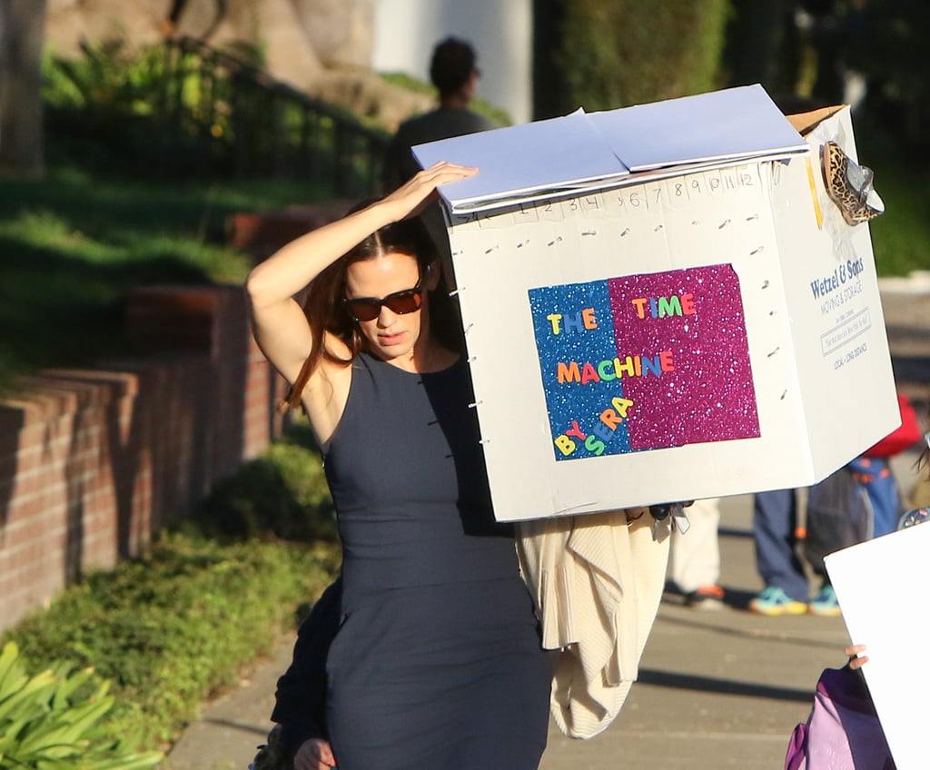 Jennifer Garner took one for the team (the team being the Garner-Affleck family) when she lugged her daughter Seraphina's school project down the street in LA on Thursday. The actress stayed chic in a navy dress and heels while carrying the giant box, which was adorably covered in glitter and had a shoe taped to it. It also read in bright letters "The Time Machine by Sera" — we can't help but wonder if the 7-year-old got help from her famous parents on the assignment. Jennifer's devotion to her kids has been evident in her recent outings; she and estranged husband Ben Affleck linked up for their little ones' first day of school in September, and days later she was spotted schlepping backpacks and lunch bags while dropping her daughters off at karate class. 
About her eldest child, Violet, who is turning 11 in December, Jennifer revealed that she's already a little worried about her looming teenage years. "Her school has a no social media policy until sixth grade," she told Today's Natalie Morales, adding, "But I know it's coming soon."

    Related:

            
                            
                    Jennifer Garner and Reese Witherspoon Gather With Famous Friends to Support a Good Cause
                
                            
                    Jennifer Garner, Reese Witherspoon, and Halle Berry Outshine the Diamonds at a Tiffany&apos;s Event