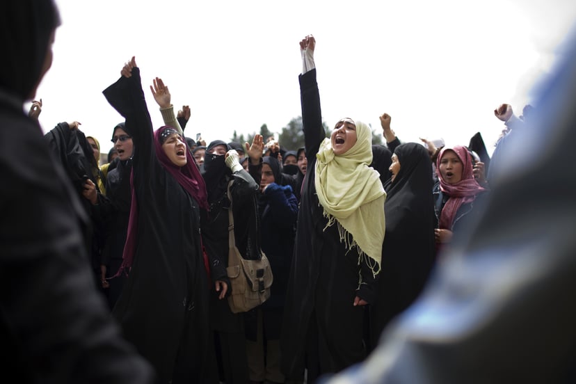 KABUL, AFGHANISTAN - APRIL 15: A group of Shia women supporting a new family law confront opponents of the law on April 15, 2009 in Kabul, Afghanistan. Opponents denounce the law as a step back toward oppressiveness of the Taliban era but supporters say i