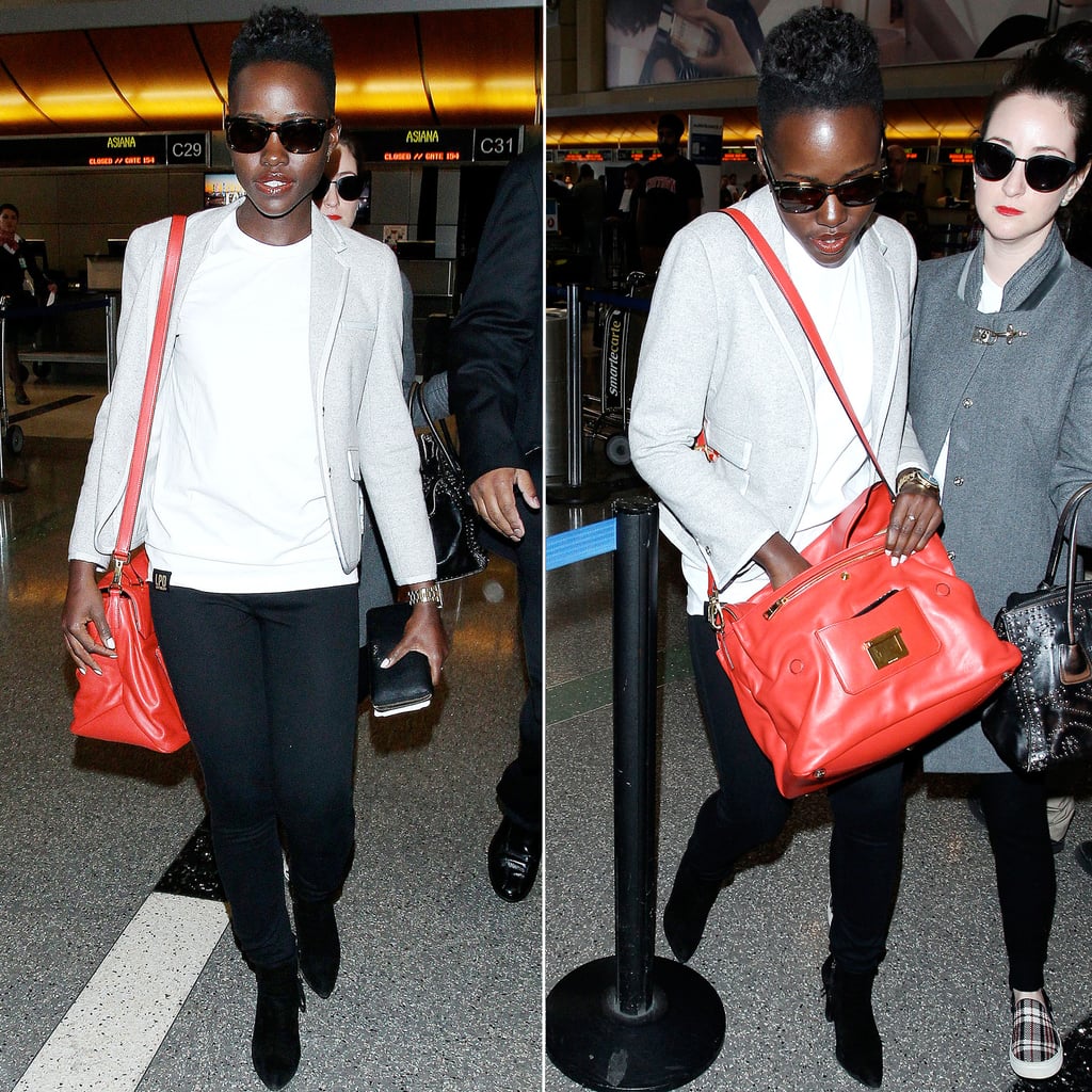 Lupita Nyong'o at Airport With Red Miu Miu Bag