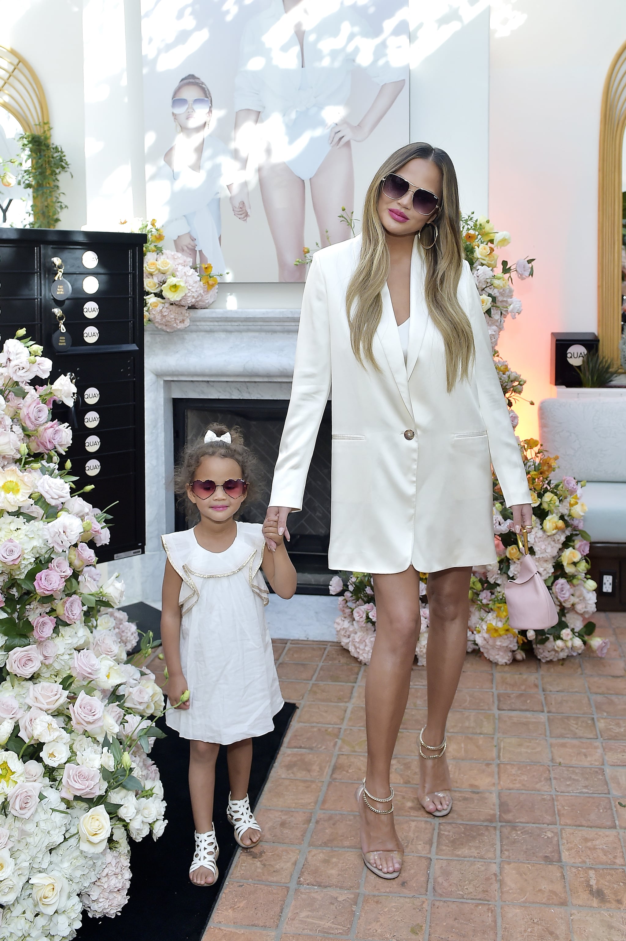 Chrissy Teigen John Legend And Luna At Quay Event Photos Popsugar Celebrity