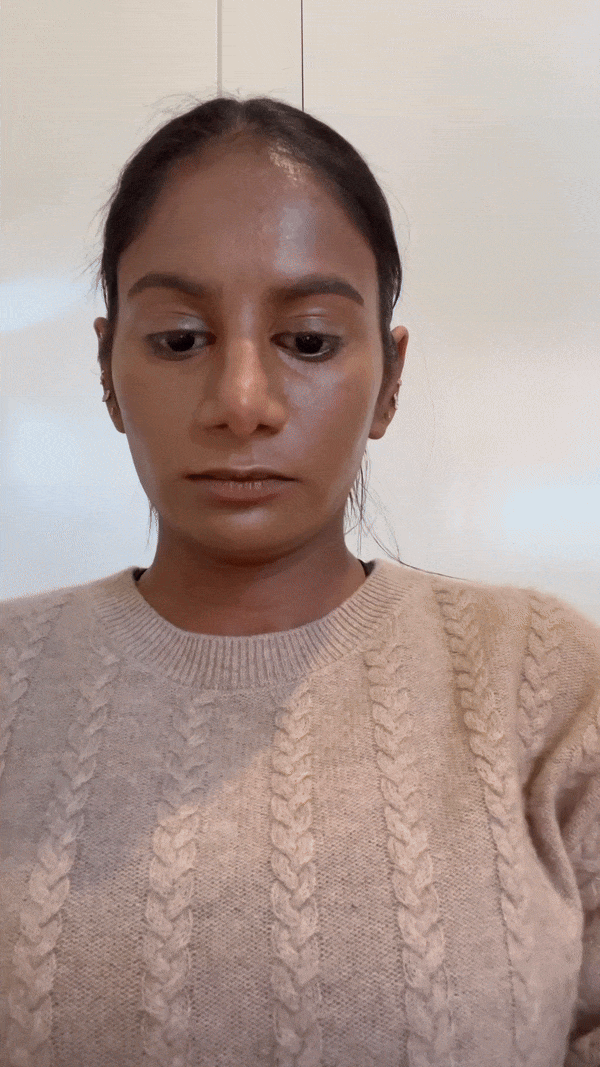 Woman using the Mango People Multisticks. Gulabi on the cheeks, Tabla as contour, Fudge as eyeshadow, and Cherry on the lips.