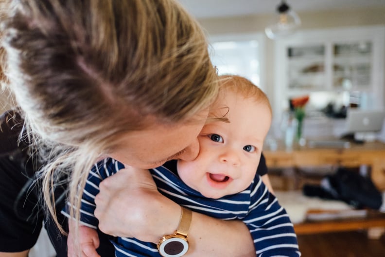 Mom kissing baby