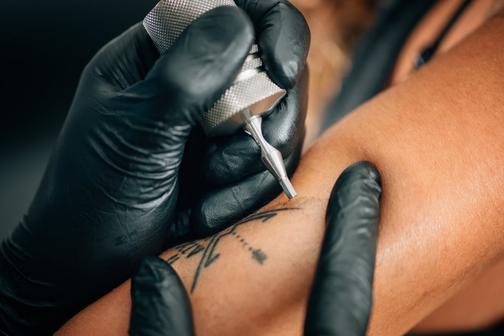 What Should I Do to Make Sure My Tattoo Doesn't Get Infected?
Whether or not your tattoo ends up getting infected is all dependent on your aftercare practices, which is dependent on making sure the area stays clean. "Keeping the tattooed area clean is the most crucial part of preventing an infection," Dagger said. "Don't apply ointment on the tattoo with dirty hands, and make sure your hands are washed thoroughly before touching the tattoo."
Outside of cleaning your tattoo, you should also avoid taking baths, going to the pool, or anything else that involves submerging your body in water so it can heal properly.
What Happens If an Infected Tattoo Isn't Treated Properly?
Not that we actually needed to tell you this, but if you think your tattoo is infected, you should absolutely take steps toward treating it. "If an infection is not treated properly, your tattoo will not heal, can fall out completely, and/or leave scarring," Dagger said.