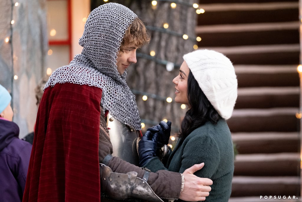 Pour the spiced wine and get ready to settle in, because Netflix has another holiday rom-com headed your way: The Knight Before Christmas! The movie stars The Princess Switch alum Vanessa Hudgens, and judging by the photos Netflix shared with us, it's going to be seriously cute.
The film, as you can probably assume from the title, indeed involves a medieval knight named Sir Cole (Poldark's Josh Whitehouse) who is sent by a sorceress to present day and meets a jaded science teacher, Brooke (Hudgens), who's all but given up on love. Brooke agrees to help the confused and overwhelmed Cole navigate the ups and downs of the modern age — will he get addicted to Twitter? Eat an entire jar of Nutella in one sitting? — and try to figure out how they can send him back home. But, as luck would have it, Sir Cole just might be Brooke's soulmate, and sparks begin to fly between the time-crossed pair right around Christmas.
Keep scrolling to see all the adorable photos from The Knight Before Christmas, which also stars Emmanuelle Chriqui, Isabelle Franca, Ella Kenion, and Jean-Michel Le Gal. Then be sure to circle Nov. 21 on your calendar — that's when you'll be able to watch Brooke and Sir Cole's love story unfold for yourself!