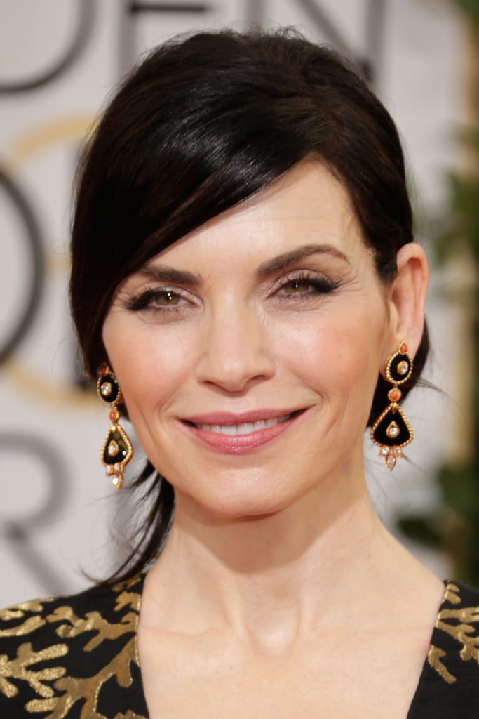 Julianna Margulies echoed the black and gold of her gown with Van Cleef & Arpels "1973" earrings.