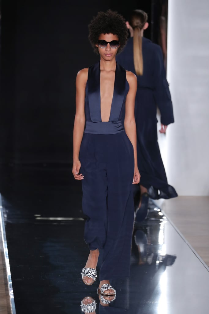 For a little sex appeal, she might want to consider this Valentin Yudashkin navy-blue jumpsuit with satin details and a low-cut neckline.