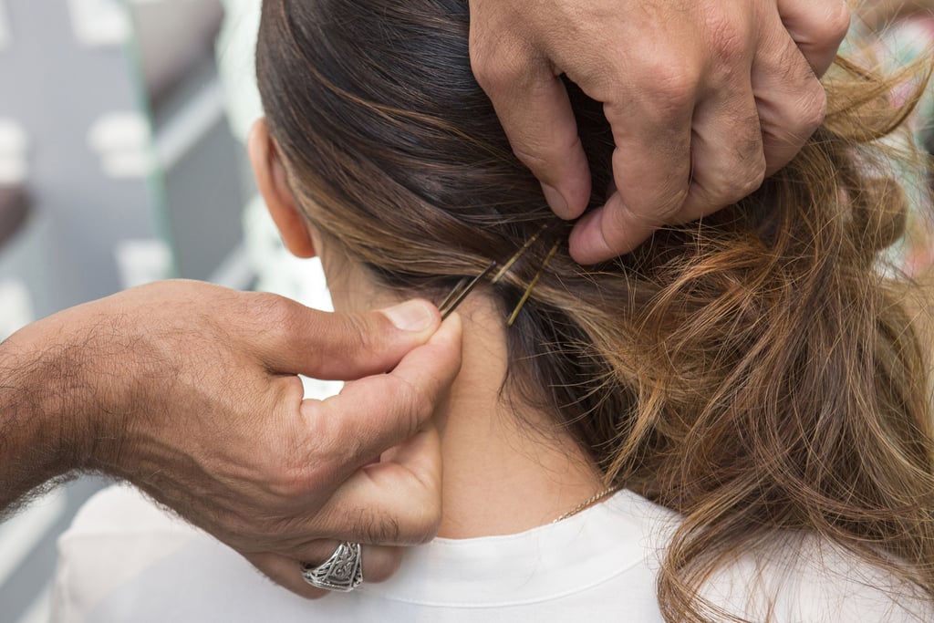 Pull the waves to one side, securing the hair with bobby pins at the neck to keep it in place.