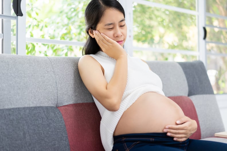 Pregnant woman, she feels toothache due to lack of calcium.