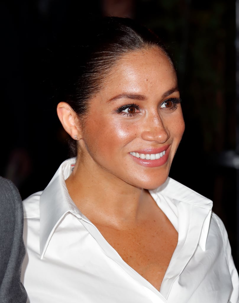 Meghan kept the neckline relaxed in an open style.