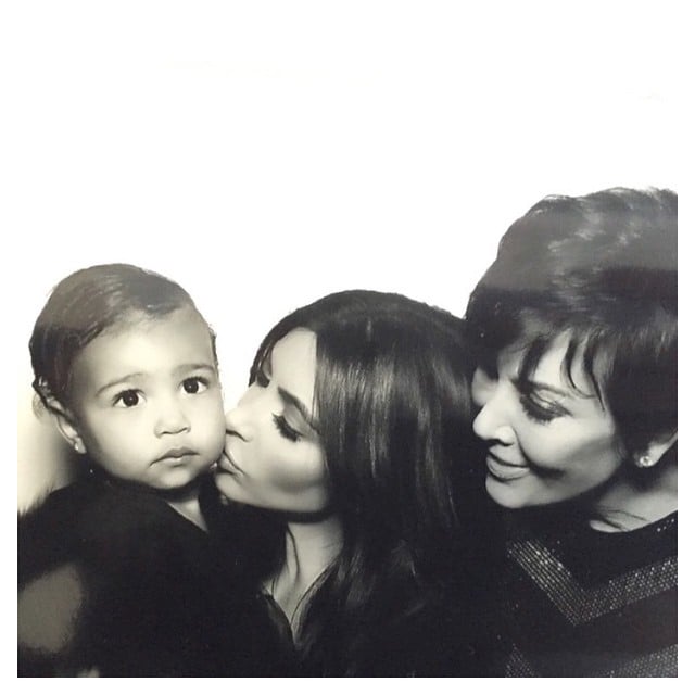 Kim gave North a kiss while Kris looked on during Kim and Kanye's 2014 wedding.