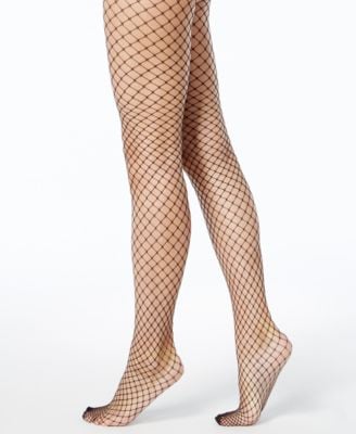 DKNY Women's Open Fishnet Tights Miley Cyrus And Dua Lipa Bring Us '80s  Edge In Prisoner, With Some Designer Looks In The Mix POPSUGAR Fashion  Photo 14