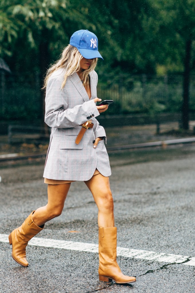 Make a blazer the whole outfit, then run with the accessories, like a baseball cap and boots for a cool-girl juxtaposition.