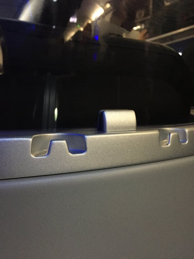 I didn't notice until the flight was over that there were handy hooks for hanging a small purse or coat.