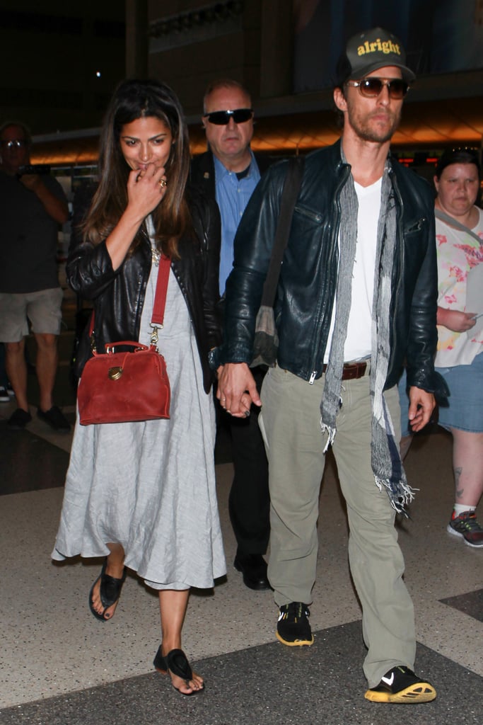 Matthew McConaughey and his wife, Camila Alves, landed at LAX holding hands on Monday.