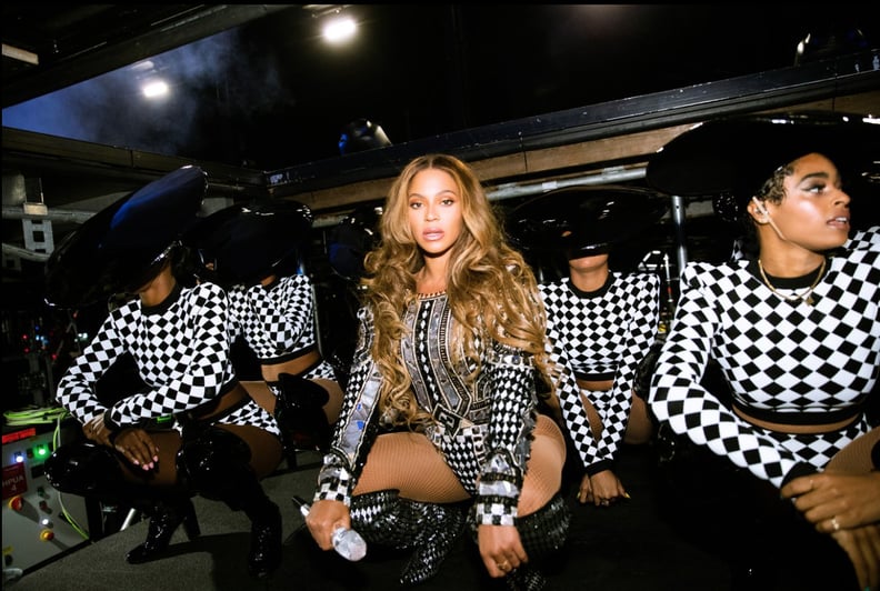 Matching Her Backup Dancers in a Checkered Bodysuit
