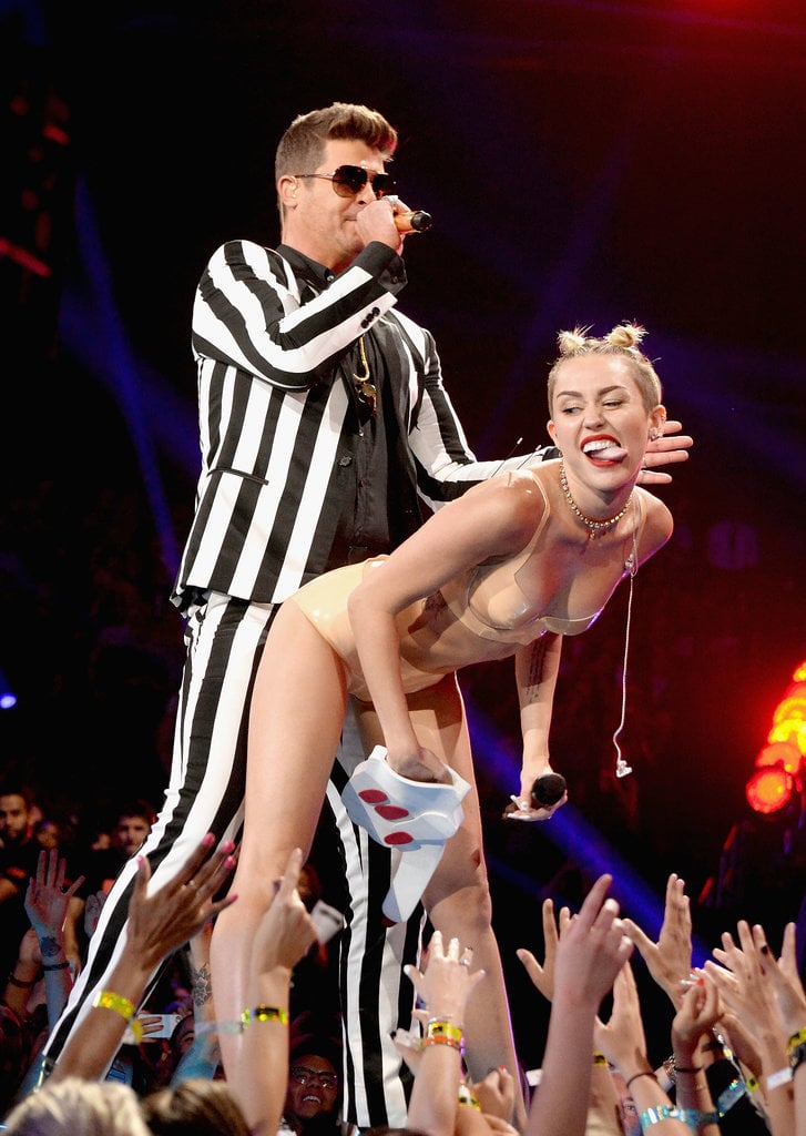 It's the performance that had the whole world talking — Miley Cyrus twerked against Robin Thicke's groin during their performance of "Blurred Lines" at the MTV VMAs in 2013.
It's the performance that had the whole world talking — Miley Cyrus twerked against Robin Thicke's groin during their performance of "Blurred Lines" at the MTV VMAs in 2013.