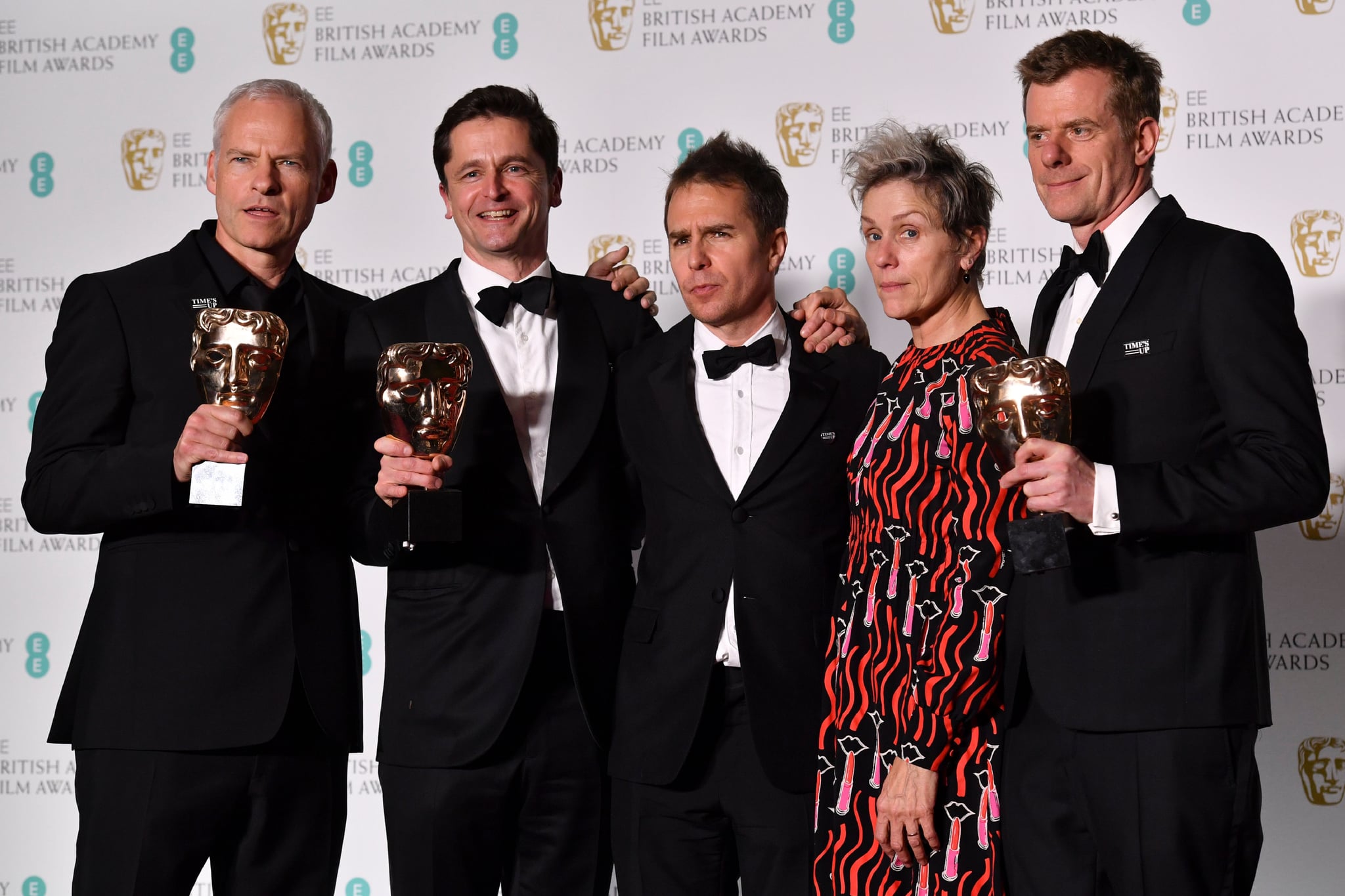 TOPSHOT - British-Irish filmmaker Martin McDonagh (L), producer Peter Czernin (2L), supporting actor award winner US actor Sam Rockwell, and British producer Graham Broadbent (R) pose with leading actress award winner US actress Frances McDormand (2R) after receiving the award for Best Film for 'Three Billboards Outside Ebbing Missouri' at the BAFTA British Academy Film Awards at the Royal Albert Hall in London on February 18, 2018. (Photo by Ben STANSALL / AFP)        (Photo credit should read BEN STANSALL/AFP/Getty Images)