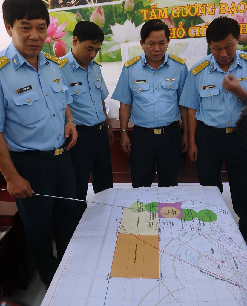 The chief of staff of Vietnam Air Force's 370 Division pointed at a map while discussing the search efforts at Tan Son Nhat International Airport in Ho Chi Minh City, Vietnam, on Saturday.