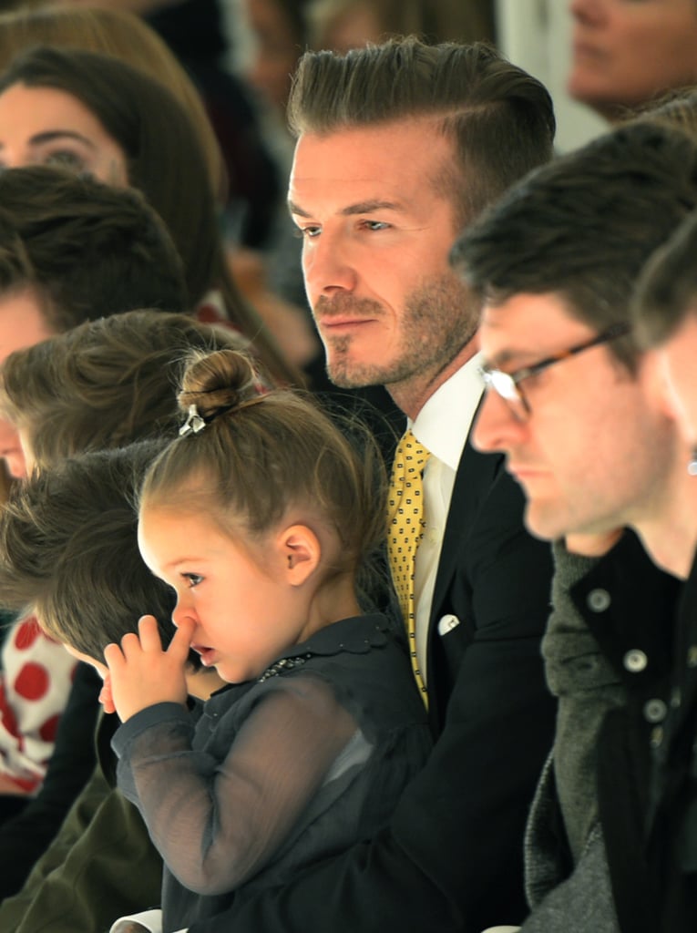 David Beckham held Harper while the father-daughter duo watched Victoria Beckham's fashion show in NYC on Sunday.