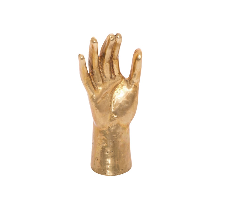 Kelly Wearstler has really beautiful decorative pieces, and the Saints Hand ($225) is so elegant; you can put jewelry on it or use it as a sculpture, and it's a great housewarming gift that everyone will comment on."