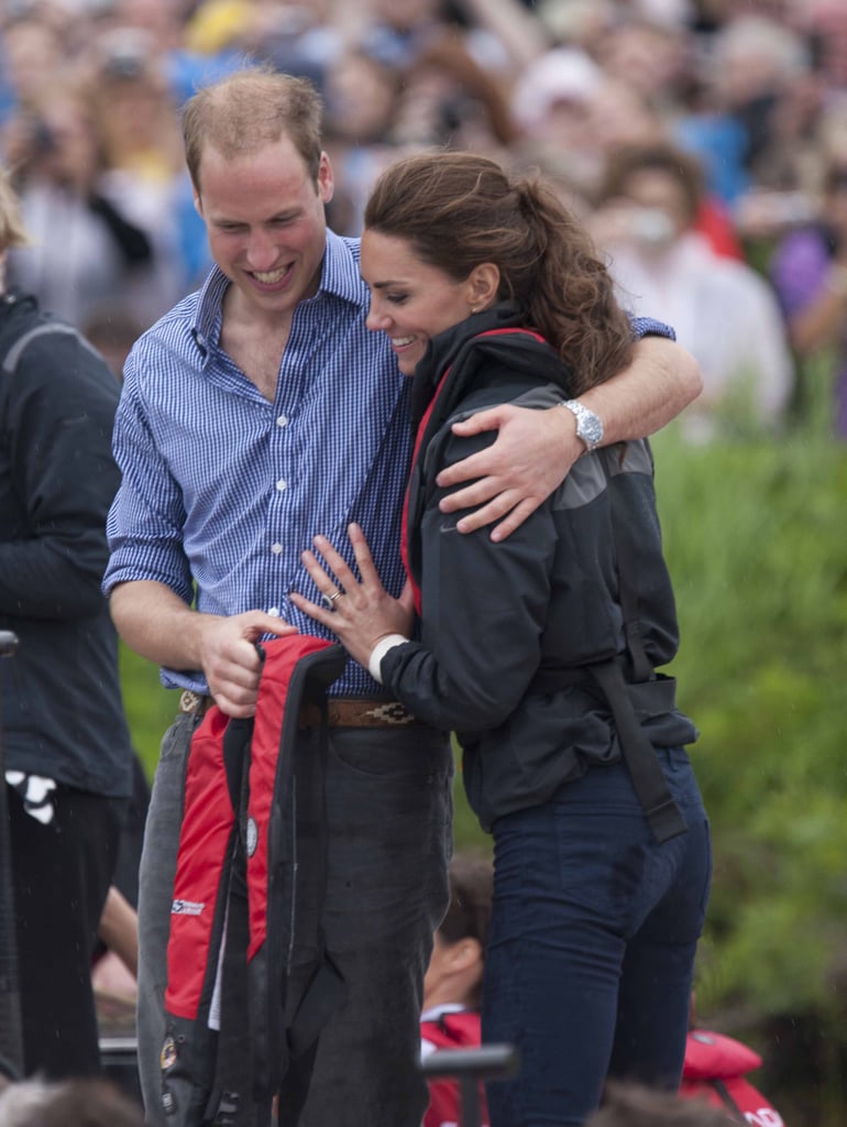 They shared a hug after participating in a dragon boat race in Canada in July 2011.