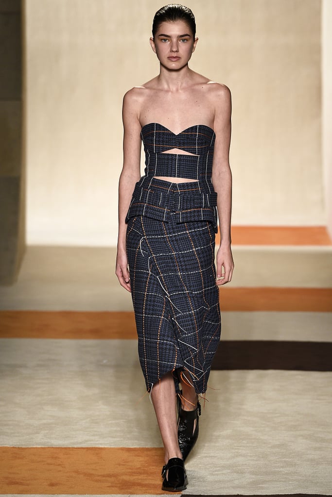 The look originally debuted on the runway with a cutout bustier and a pair of loafers.