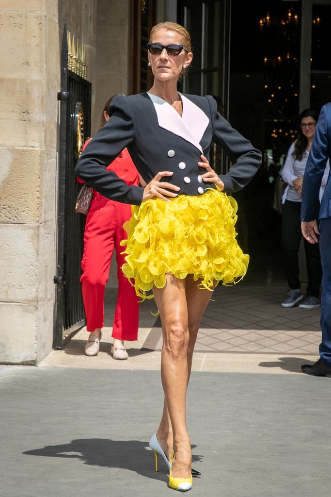 Playing with opposites, Celine paired this structured Ronald Van Der Kemp blazer with a whimsical marigold skirt. Note the mismatched Jimmy Choos.