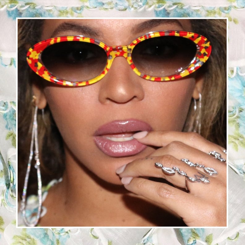 A Close Up of Her Sunglasses and Rings