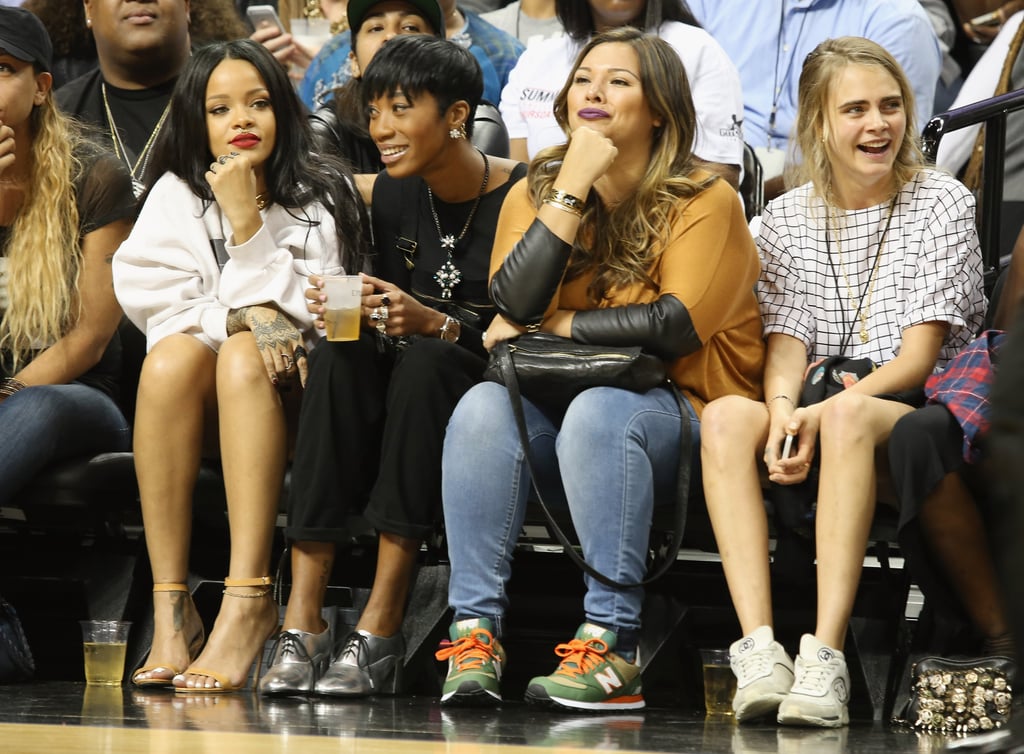 Rihanna sat with a group of girlfriends, including Cara Delevingne.